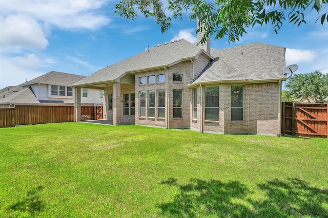 1910 Saint Johns Ave, Allen, TX 75002 - rear view of house with brick siding, a fenced backyard, and a chimney