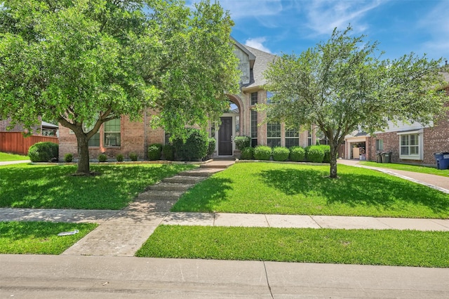 1910 Saint Johns Ave, Allen, TX 75002 - obstructed view of property featuring brick siding and a front yard