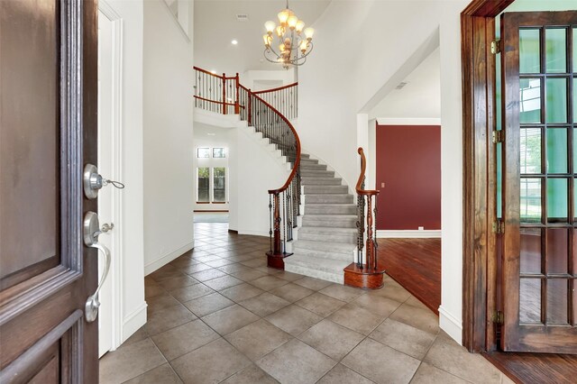 1910 Saint Johns Ave, Allen, TX 75002 - entryway featuring stairs, tile patterned flooring, a chandelier, a high ceiling, and recessed lighting