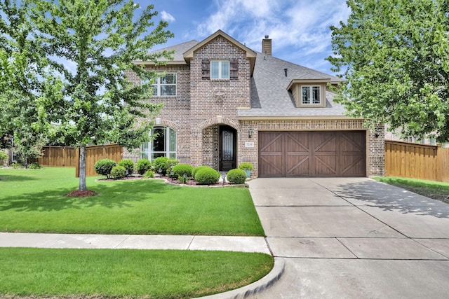 7219 Brisa Rd, Grand Prairie, TX 75054 - view of front of home with brick siding, concrete driveway, a chimney, and roof with shingles