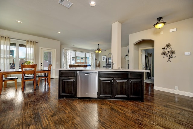 7219 Brisa Rd, Grand Prairie, TX 75054 - kitchen featuring stainless steel dishwasher, arched walkways, light countertops, dark wood-style floors, and a ceiling fan