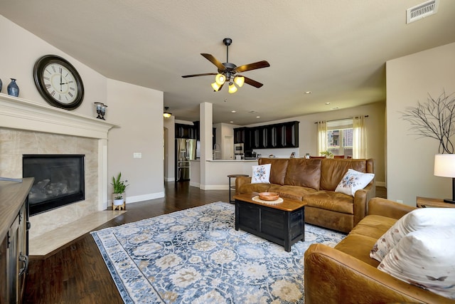 7219 Brisa Rd, Grand Prairie, TX 75054 - living area featuring a ceiling fan, wood finished floors, a premium fireplace, and recessed lighting
