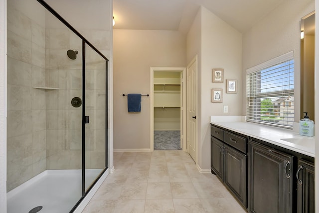 7219 Brisa Rd, Grand Prairie, TX 75054 - full bathroom with a shower stall, vanity, and a walk in closet