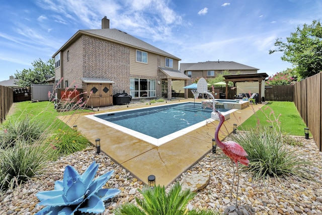 7219 Brisa Rd, Grand Prairie, TX 75054 - view of pool with a gazebo, a fenced backyard, a pool with connected hot tub, area for grilling, and a patio