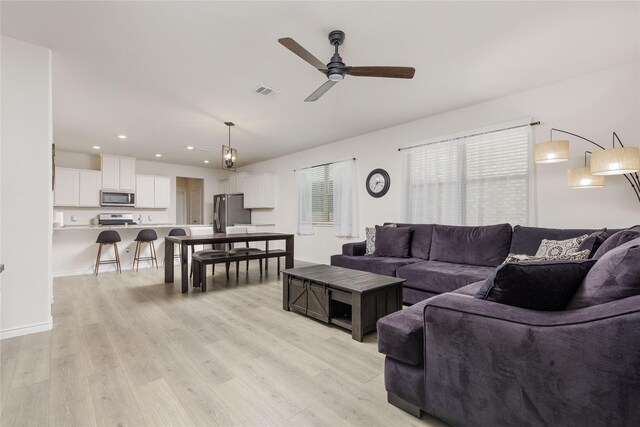2265 Obsidian Dr, Little Elm, TX 76227 - living room featuring ceiling fan, light wood finished floors, and recessed lighting
