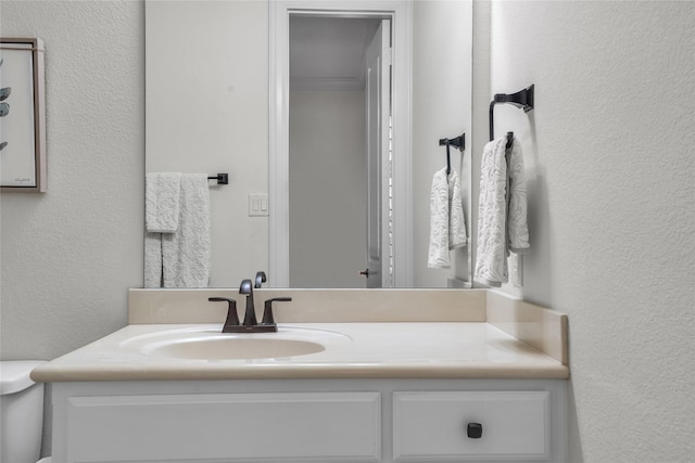 1400 Lakeside Dr, Prosper, TX 75078 - bathroom featuring vanity and a textured wall