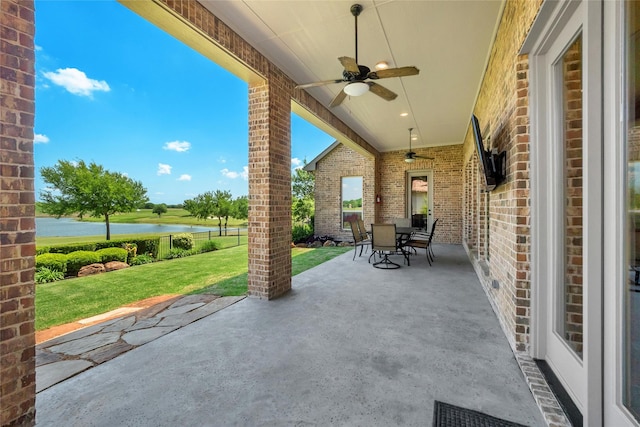 1400 Lakeside Dr, Prosper, TX 75078 - view of patio featuring a water view, a ceiling fan, and outdoor dining area