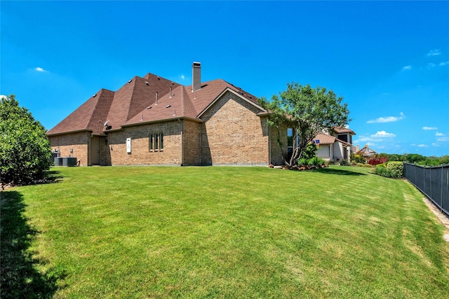 1400 Lakeside Dr, Prosper, TX 75078 - back of property featuring brick siding and a chimney