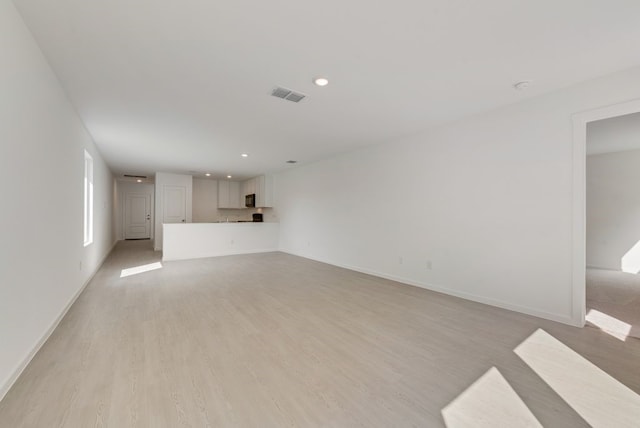 1657 Crested Way, Fort Worth, TX 76140 - unfurnished living room with recessed lighting and light wood finished floors