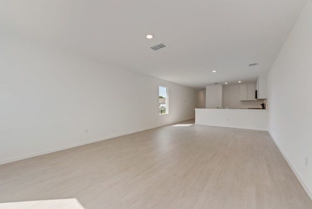 1657 Crested Way, Fort Worth, TX 76140 - unfurnished living room featuring light wood-style flooring and recessed lighting