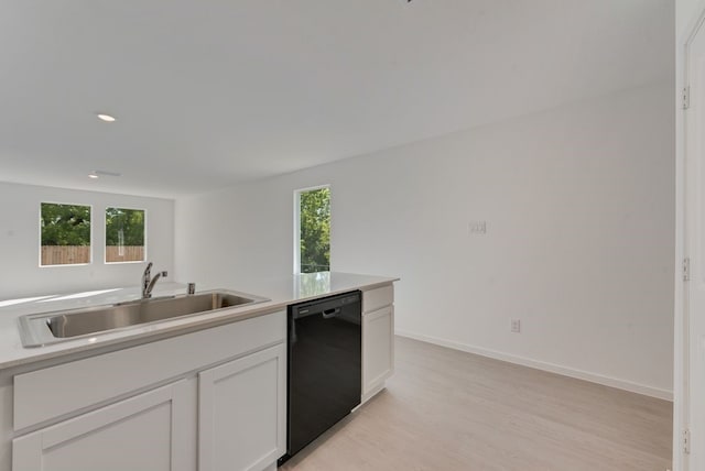 1657 Crested Way, Fort Worth, TX 76140 - kitchen with black dishwasher, light wood-type flooring, light countertops, white cabinetry, and recessed lighting