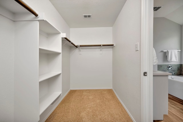 5361 Brentlawn Dr, Fort Worth, TX 76179 - walk in closet featuring light carpet