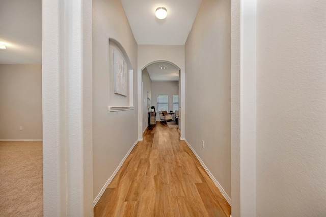 5361 Brentlawn Dr, Fort Worth, TX 76179 - hallway featuring arched walkways and light wood-type flooring