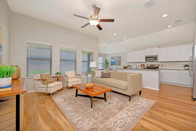 5361 Brentlawn Dr, Fort Worth, TX 76179 - living room with light wood-style floors, ceiling fan, recessed lighting, and vaulted ceiling
