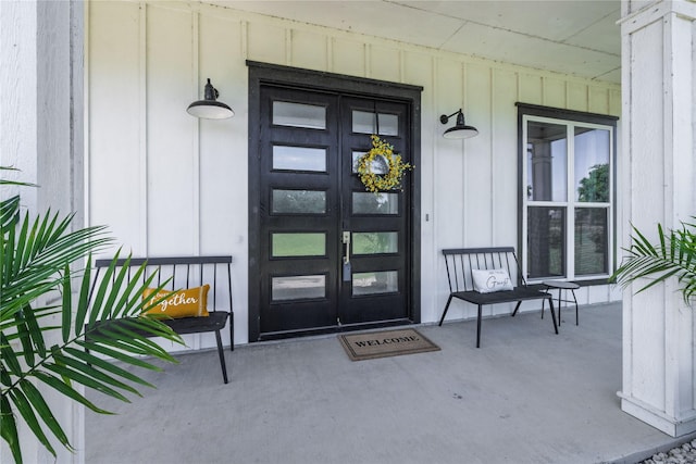 4220 County Road 703, Alvarado, TX 76009 - doorway to property with board and batten siding, a porch, and french doors