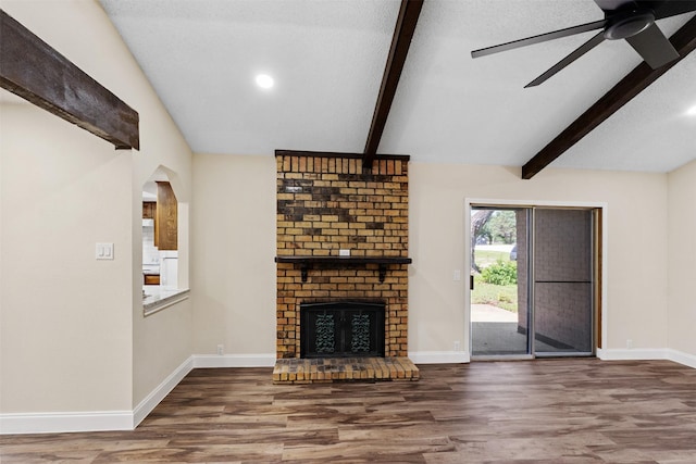 1037 Alicia Ln, Lancaster, TX 75134 - unfurnished living room featuring wood finished floors, a ceiling fan, and a brick fireplace
