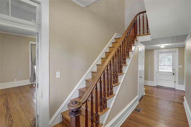 401 N Benge, Mckinney, TX 75069 - stairs with hardwood / wood-style flooring and crown molding