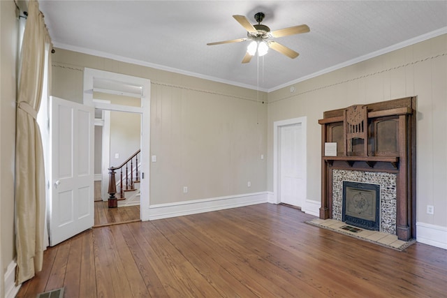 401 N Benge, Mckinney, TX 75069 - unfurnished living room with hardwood / wood-style flooring, stairway, ceiling fan, crown molding, and a tile fireplace