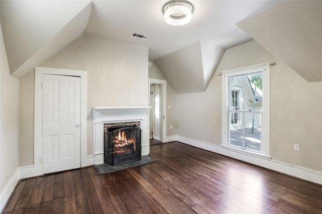 401 N Benge, Mckinney, TX 75069 - unfurnished living room with dark wood-type flooring, lofted ceiling, and a lit fireplace