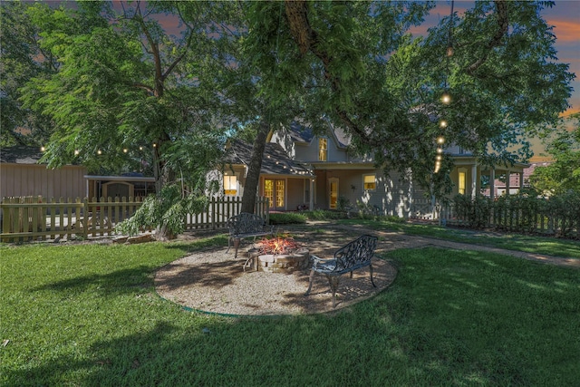 401 N Benge, Mckinney, TX 75069 - yard at dusk featuring an outdoor fire pit
