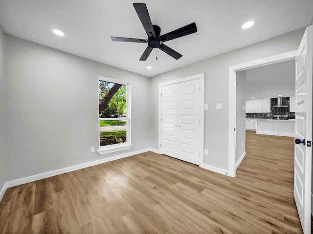 3505 Morningstar Ln, Farmers Branch, TX 75234 - unfurnished bedroom with light wood finished floors, recessed lighting, a ceiling fan, and a closet