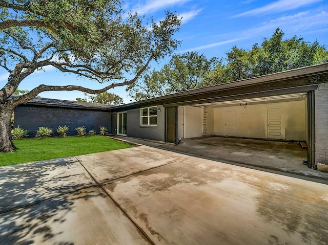 3505 Morningstar Ln, Farmers Branch, TX 75234 - view of front of home with concrete driveway, a front yard, and a patio area
