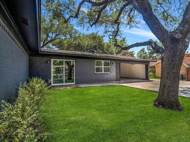 3505 Morningstar Ln, Farmers Branch, TX 75234 - view of front facade with driveway, a front lawn, brick siding, and a patio