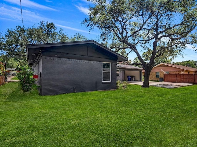 3505 Morningstar Ln, Farmers Branch, TX 75234 - back of property with driveway, brick siding, a patio, and an attached garage