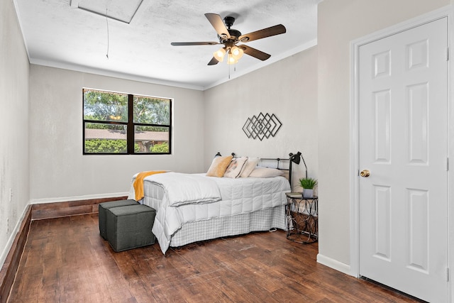 301 Sunset Blvd, Hewitt, TX 76643 - bedroom featuring attic access, wood finished floors, ornamental molding, and a ceiling fan