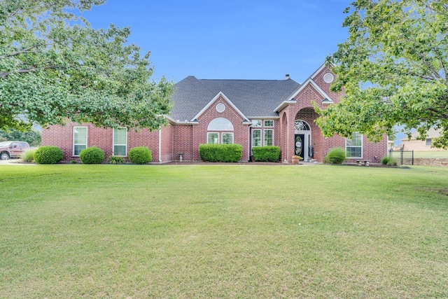 5631 Mission Ct, Midlothian, TX 76065 - view of front of property with a front yard, brick siding, and a shingled roof