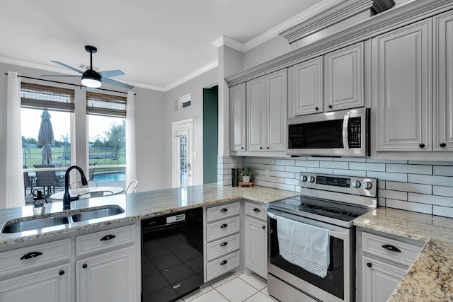 5631 Mission Ct, Midlothian, TX 76065 - kitchen featuring stainless steel appliances, ceiling fan, ornamental molding, decorative backsplash, and light stone counters