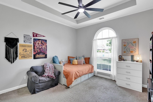 5631 Mission Ct, Midlothian, TX 76065 - carpeted bedroom with a tray ceiling, crown molding, and a ceiling fan