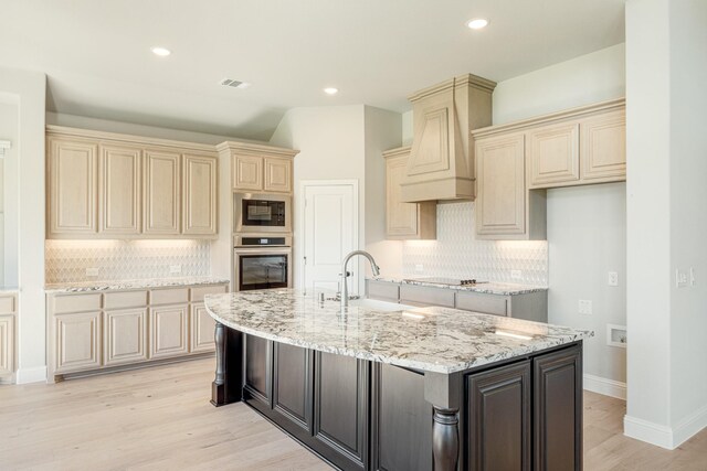 5202 Rowlan Row, Midlothian, TX 76065 - kitchen with black appliances, cream cabinetry, decorative backsplash, recessed lighting, and lofted ceiling