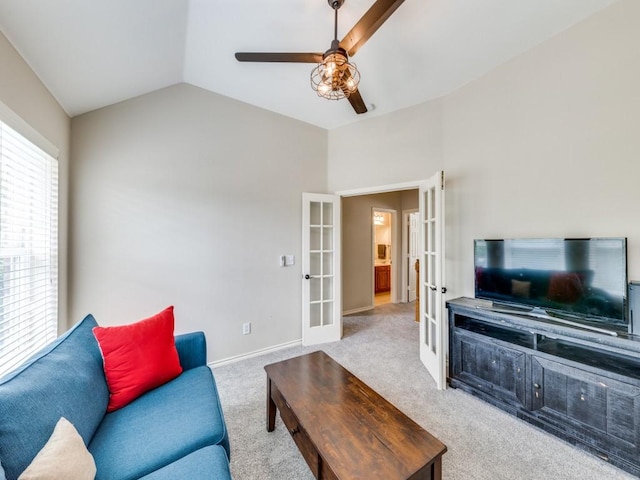 6505 Tamarron Ln, Plano, TX 75024 - living room featuring french doors, a ceiling fan, carpet flooring, and vaulted ceiling