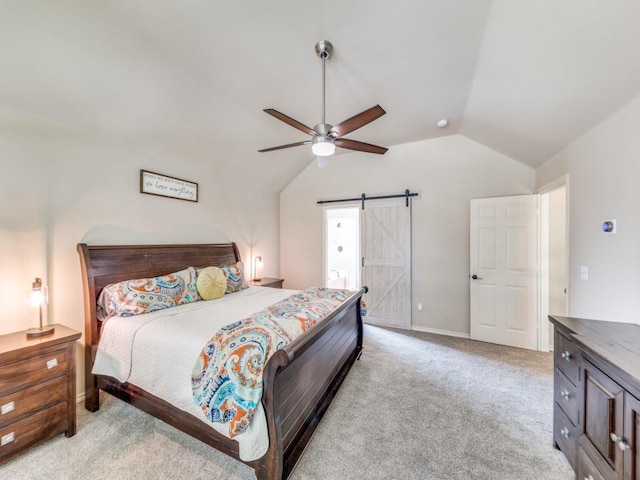 6505 Tamarron Ln, Plano, TX 75024 - bedroom featuring lofted ceiling, a barn door, light colored carpet, and ceiling fan