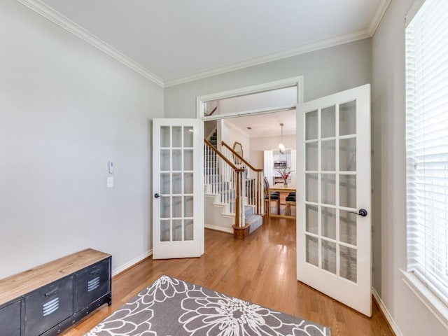 6505 Tamarron Ln, Plano, TX 75024 - unfurnished room with french doors, stairs, crown molding, wood finished floors, and a chandelier