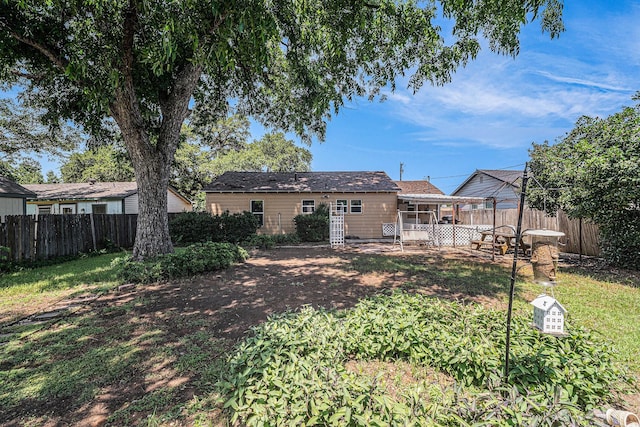 504 Harrison Ln, Hurst, TX 76053 - rear view of house featuring a fenced backyard