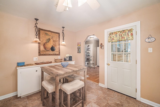 504 Harrison Ln, Hurst, TX 76053 - dining area featuring arched walkways and a ceiling fan