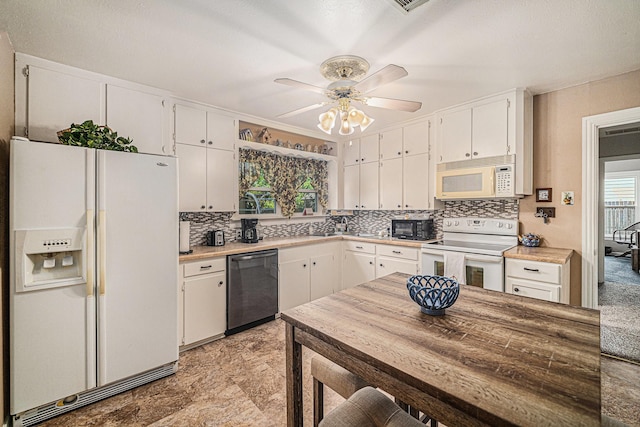 504 Harrison Ln, Hurst, TX 76053 - kitchen with white appliances, decorative backsplash, white cabinetry, a ceiling fan, and light countertops