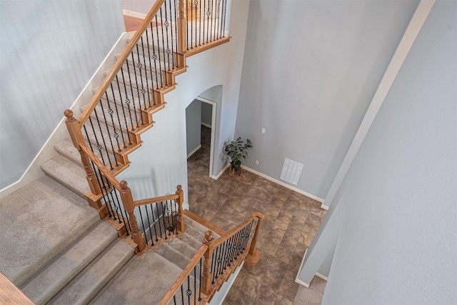 4748 Mcbreyer Pl, Fort Worth, TX 76244 - stairway with arched walkways and baseboards