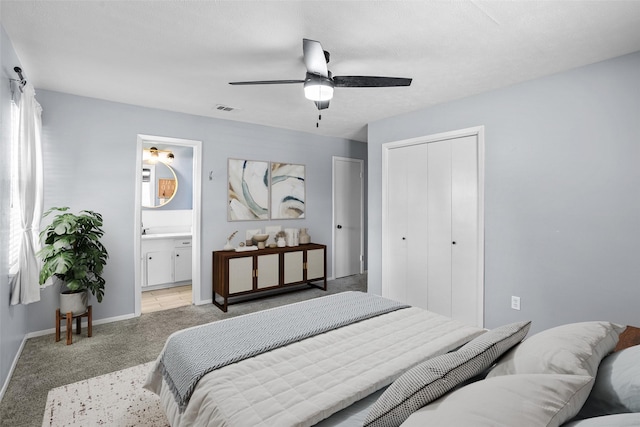1914 Normandy Dr, Irving, TX 75060 - bedroom with light colored carpet, a closet, ceiling fan, and ensuite bathroom