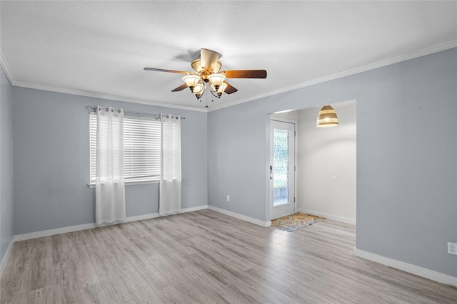 1914 Normandy Dr, Irving, TX 75060 - unfurnished room featuring a ceiling fan, wood finished floors, and crown molding