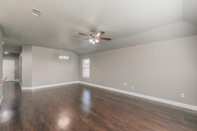 1102 David Dr, Euless, TX 76040 - empty room featuring lofted ceiling, ceiling fan, dark wood-style flooring, and a chandelier
