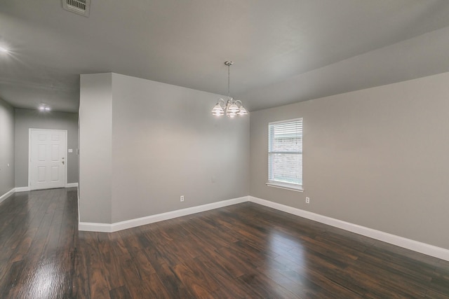 1102 David Dr, Euless, TX 76040 - unfurnished room featuring a chandelier and dark wood-style floors
