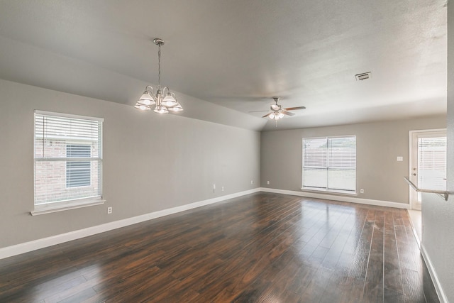 1102 David Dr, Euless, TX 76040 - spare room featuring dark wood-style floors, ceiling fan, a chandelier, and vaulted ceiling