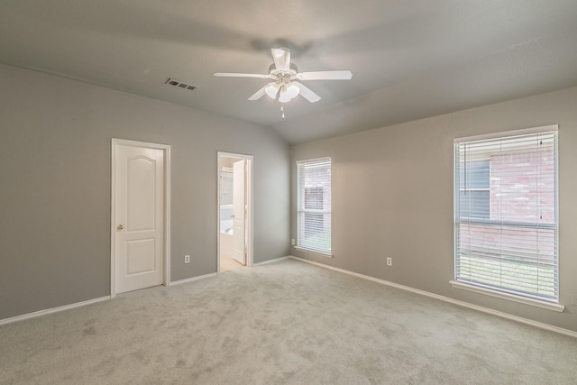 1102 David Dr, Euless, TX 76040 - unfurnished bedroom featuring light carpet, ensuite bath, vaulted ceiling, and ceiling fan
