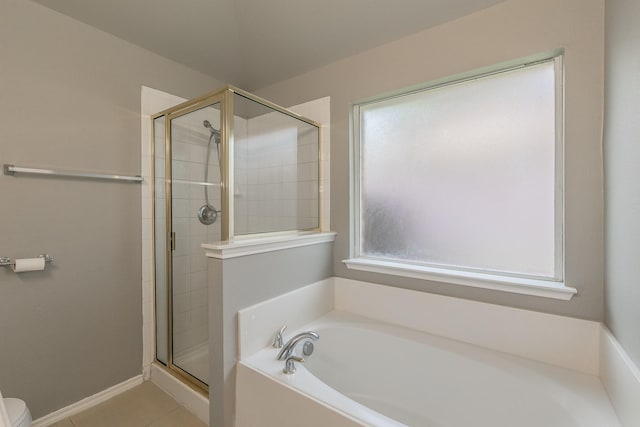 1102 David Dr, Euless, TX 76040 - bathroom with a bath, a shower stall, and tile patterned flooring