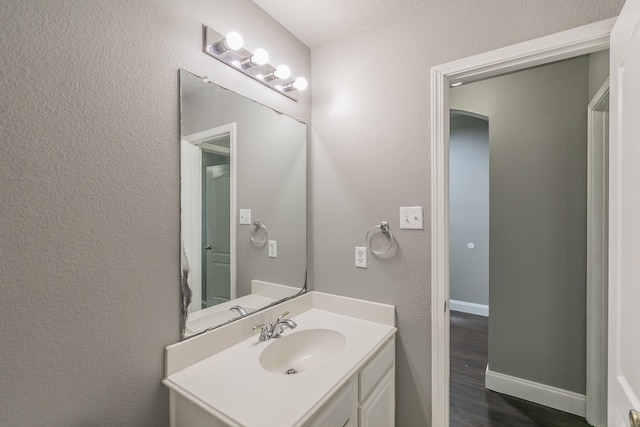 1102 David Dr, Euless, TX 76040 - bathroom featuring vanity and wood finished floors