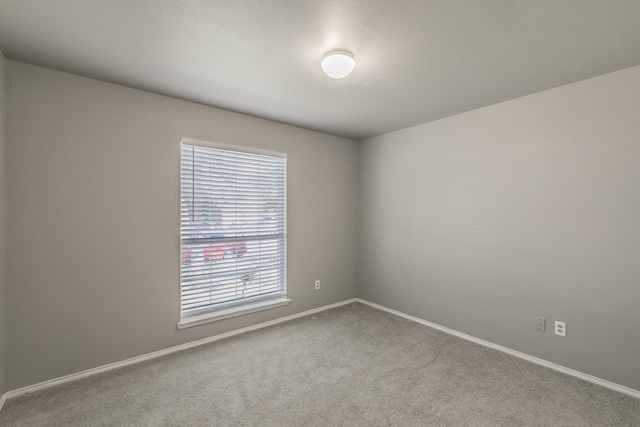 1102 David Dr, Euless, TX 76040 - carpeted empty room featuring baseboards