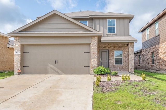 1653 Seadrift Dr, Forney, TX 75126 - traditional home with concrete driveway, an attached garage, board and batten siding, and brick siding